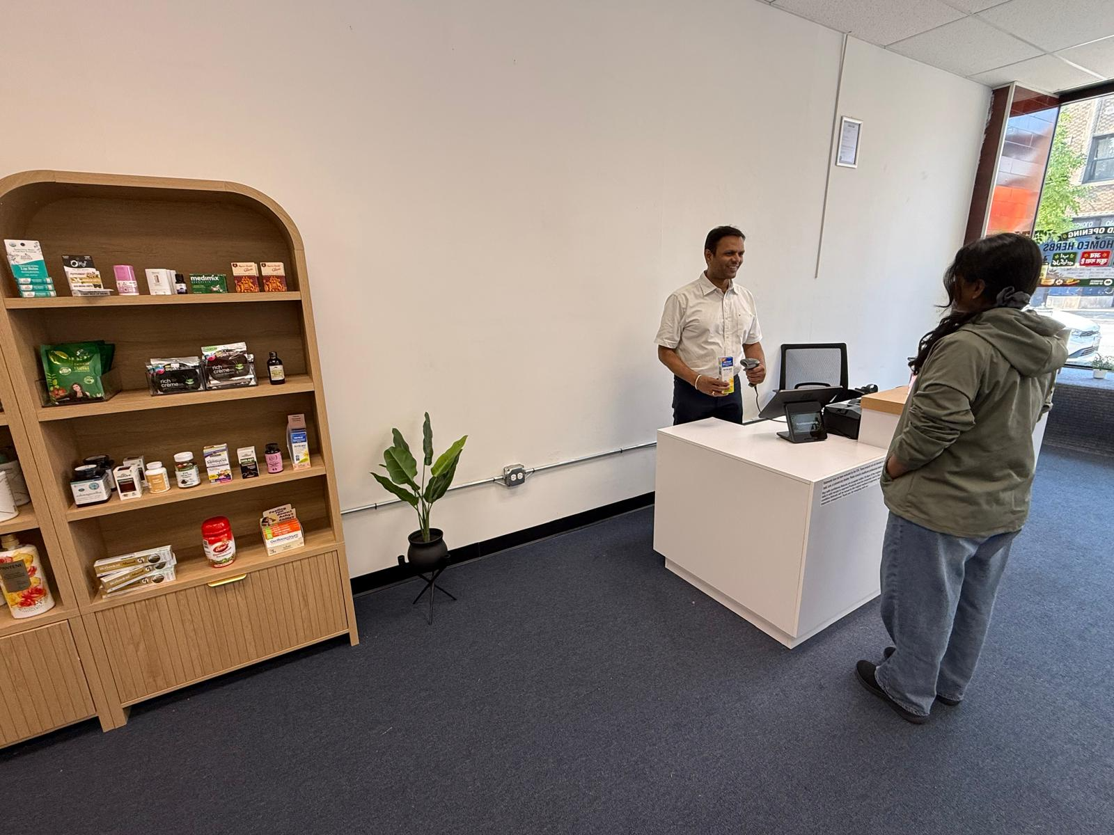 A customer receiving product guidance inside the store